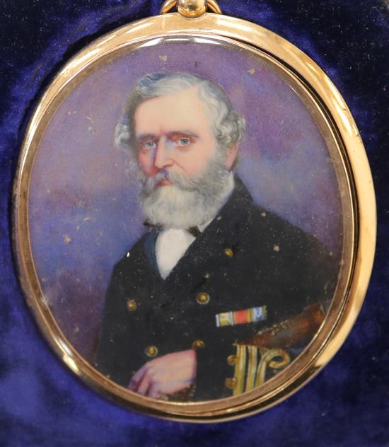 A gold framed miniature of a naval officer